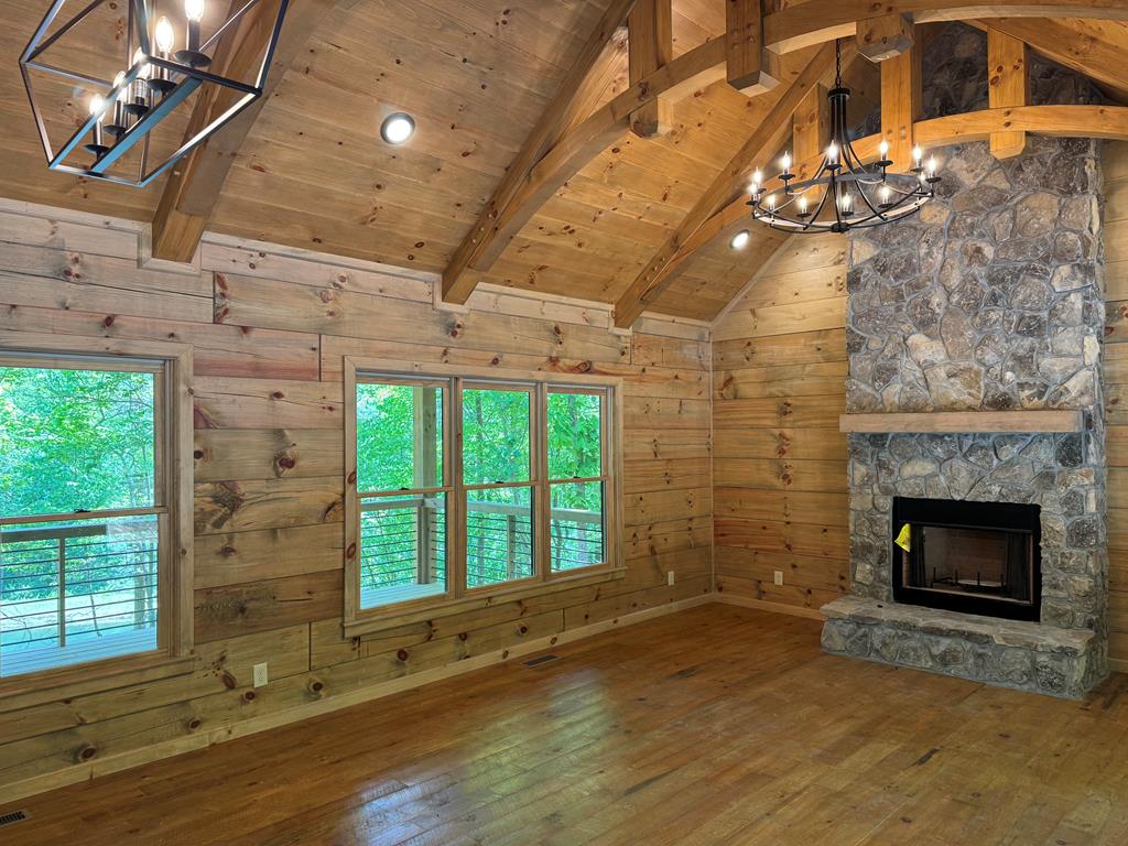 85 Moreland Trail Blue Ridge, GA 30513 - Photo 44 of 56 a living room with hard wood floors and a fireplace