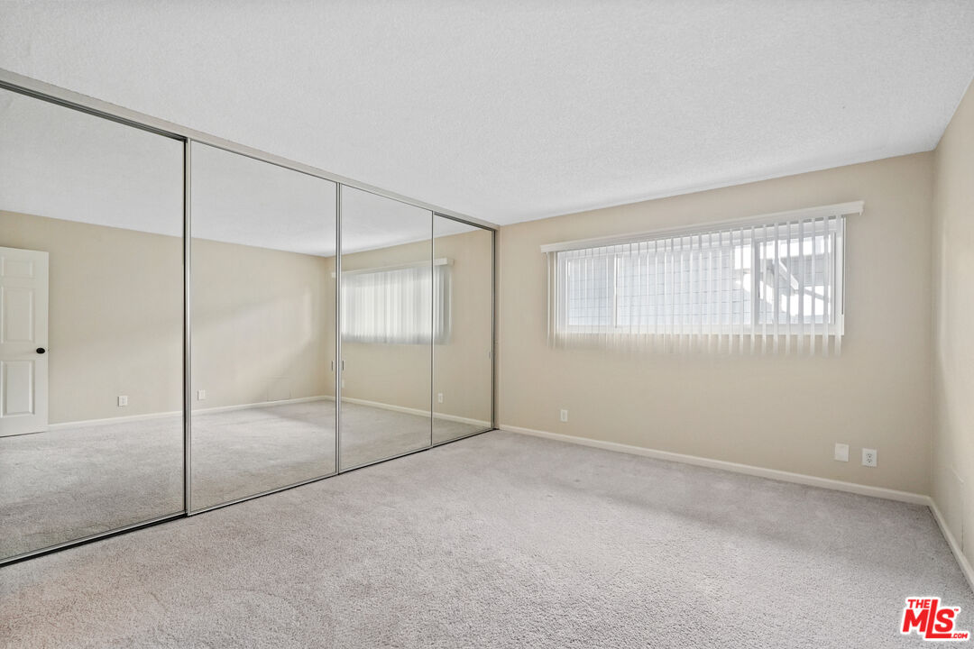18000 Coastline Drive, Unit 8 Malibu, CA 90265 - Photo 13 of 26 a view of an empty room with window