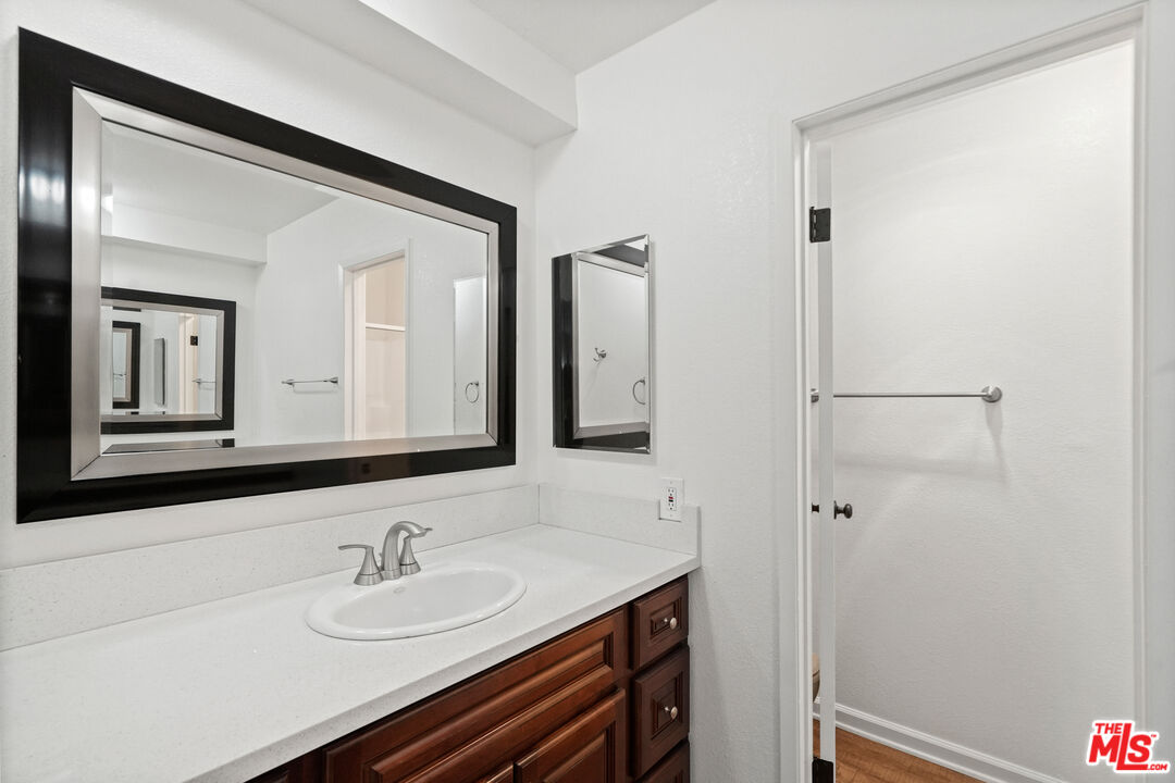 18000 Coastline Drive, Unit 8 Malibu, CA 90265 - Photo 15 of 26 a bathroom with a sink and a mirror
