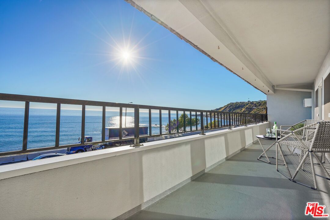 18000 Coastline Drive, Unit 8 Malibu, CA 90265 - Photo 20 of 26 a view of balcony with furniture and ocean view