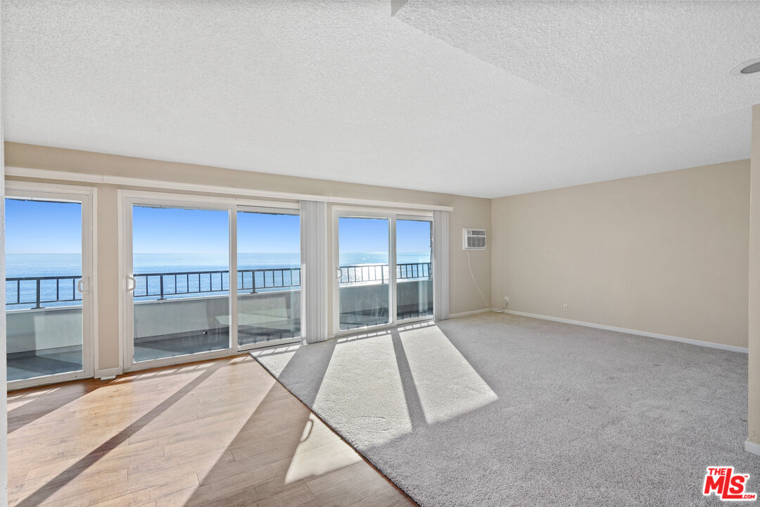 18000 Coastline Drive, Unit 8 Malibu, CA 90265 - Photo 2 of 26 an empty room with large windows