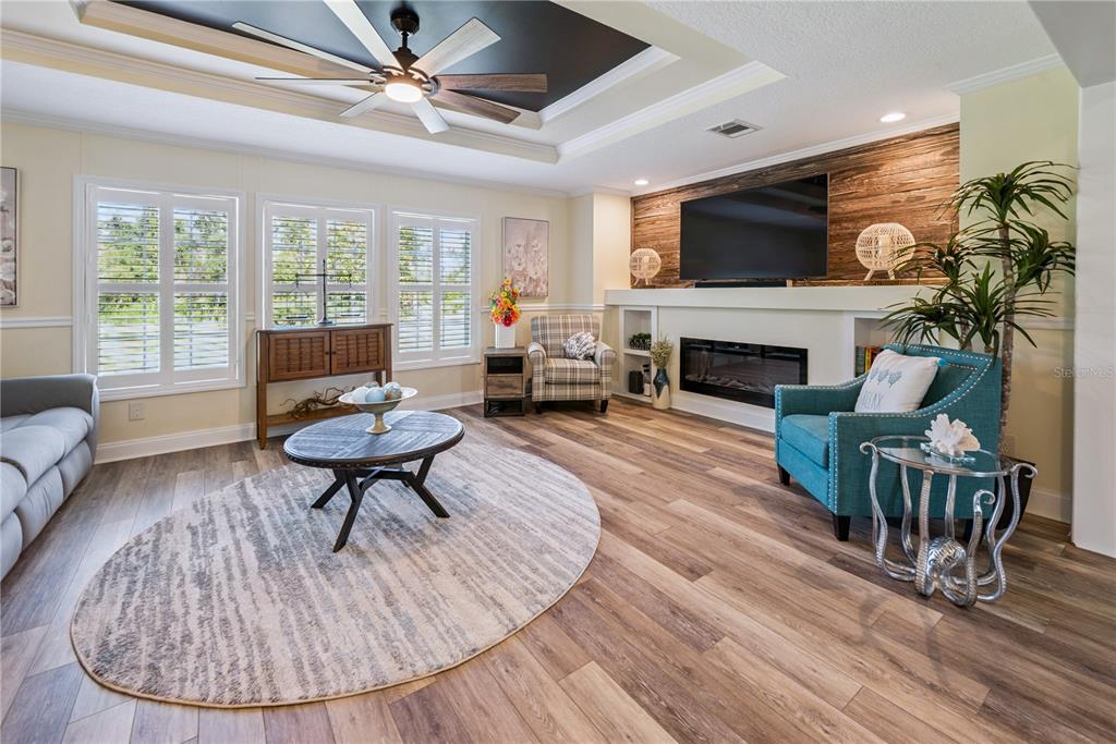 1175 Southwest 248th Avenue Steinhatchee, FL 32359 - Photo 26 of 54 a living room with furniture a fireplace and a flat screen tv