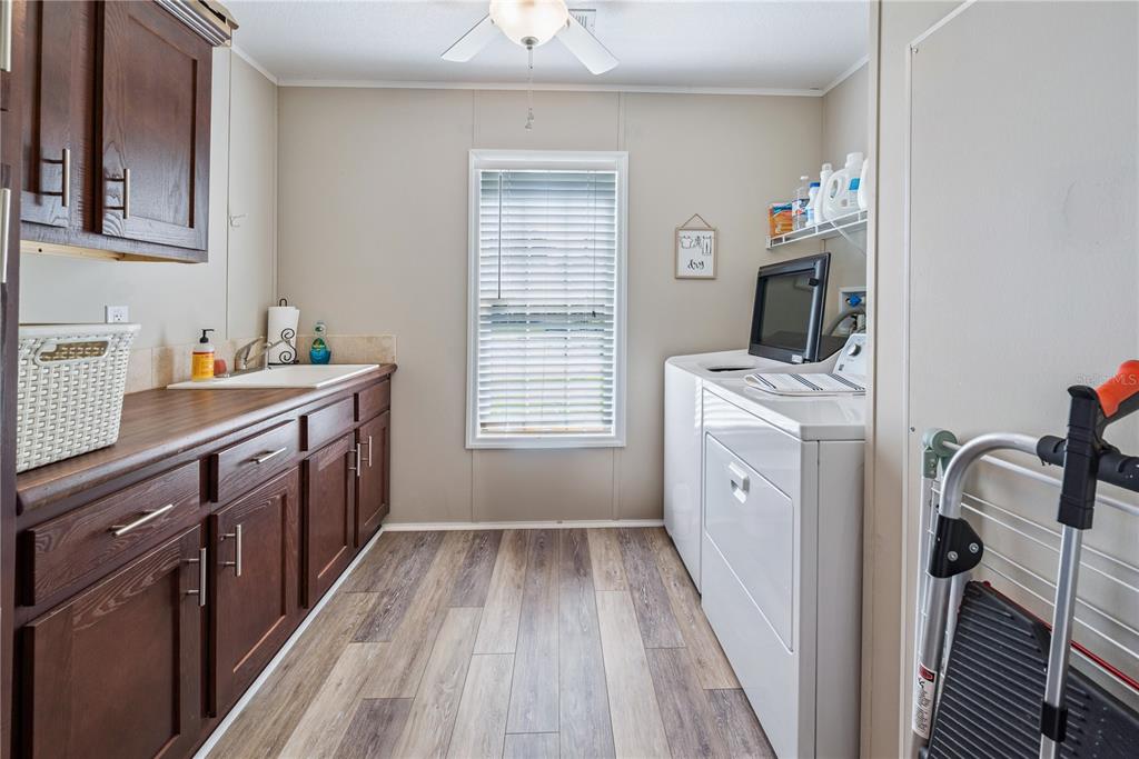 1175 Southwest 248th Avenue Steinhatchee, FL 32359 - Photo 39 of 54 a kitchen with a sink a stove and a window