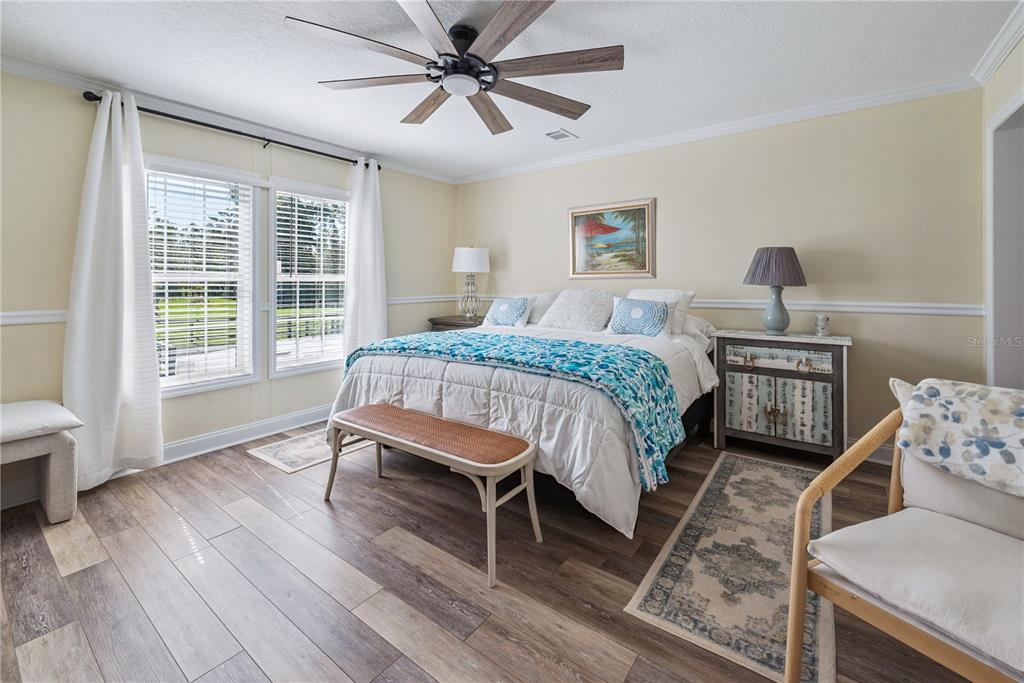 1175 Southwest 248th Avenue Steinhatchee, FL 32359 - Photo 40 of 54 a bedroom with a bed wooden floor and a window