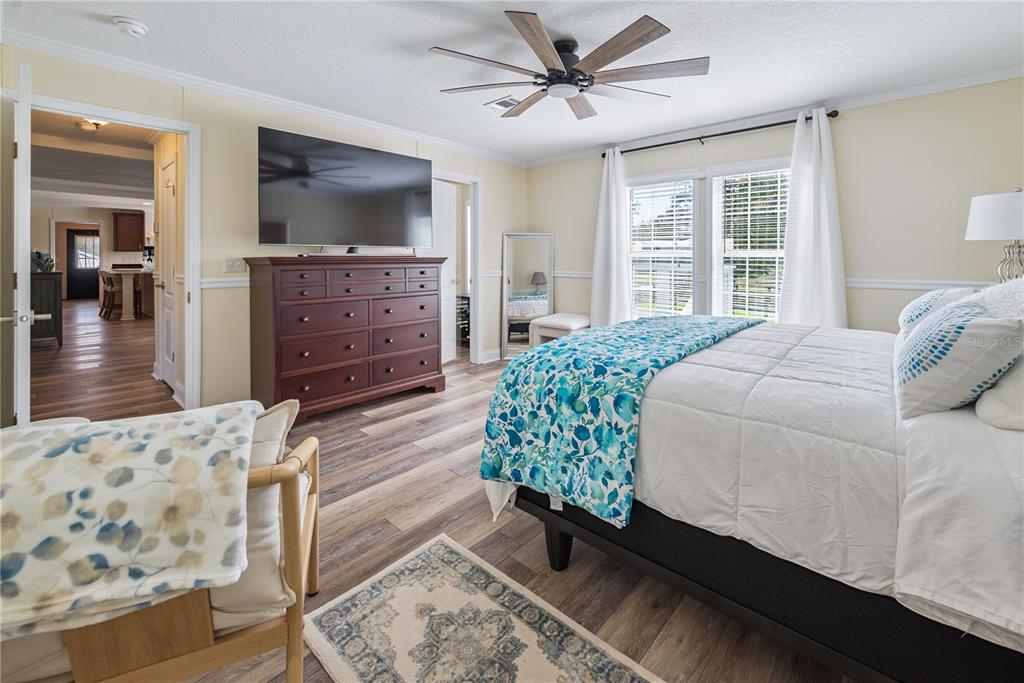 1175 Southwest 248th Avenue Steinhatchee, FL 32359 - Photo 42 of 54 a bedroom with a bed and wooden floor