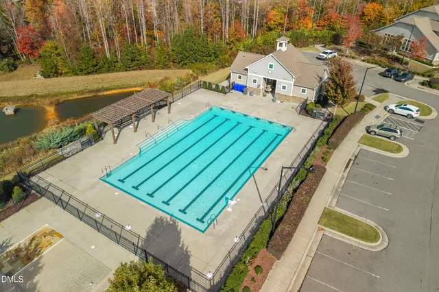 an aerial view of a house with a swimming pool