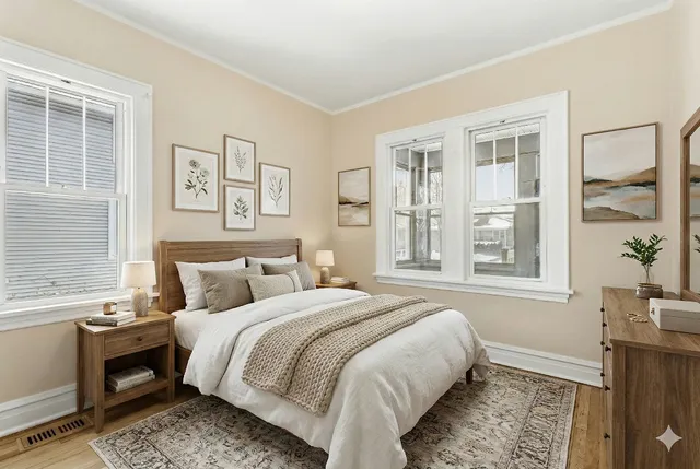 a bedroom with a bed and a window