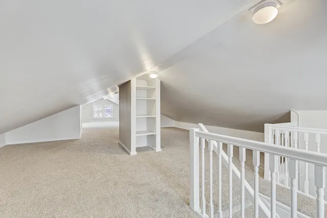 a view of an empty room with stairs