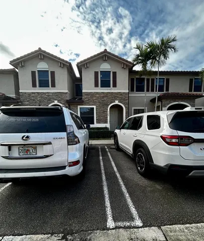 a car parked in front of a house