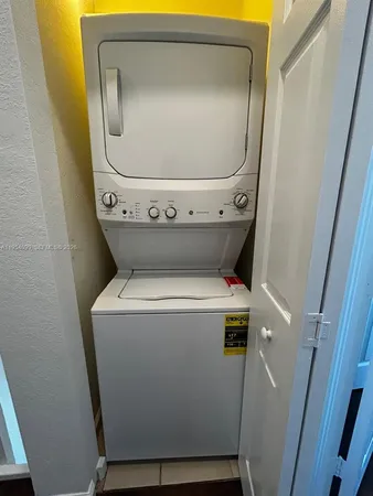 a lobby with furniture and floor to ceiling window