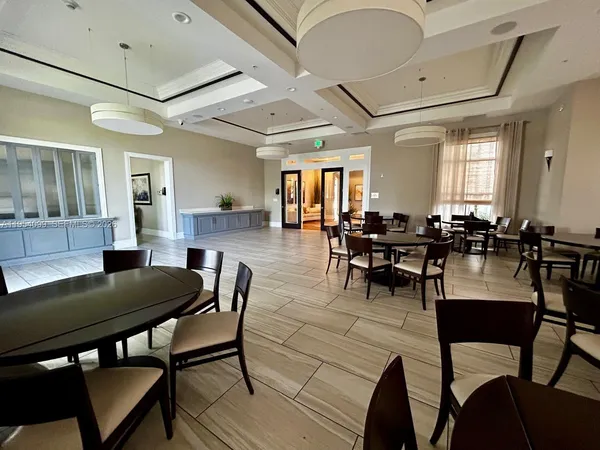 a view of a swimming pool with a garden and trees