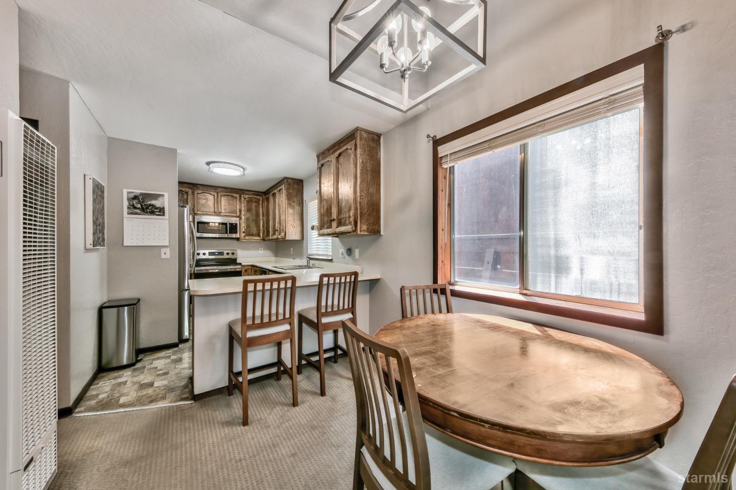 167 Tramway Drive, Unit B Stateline, NV 89449 - Photo 4 of 15 a view of a dining room with furniture