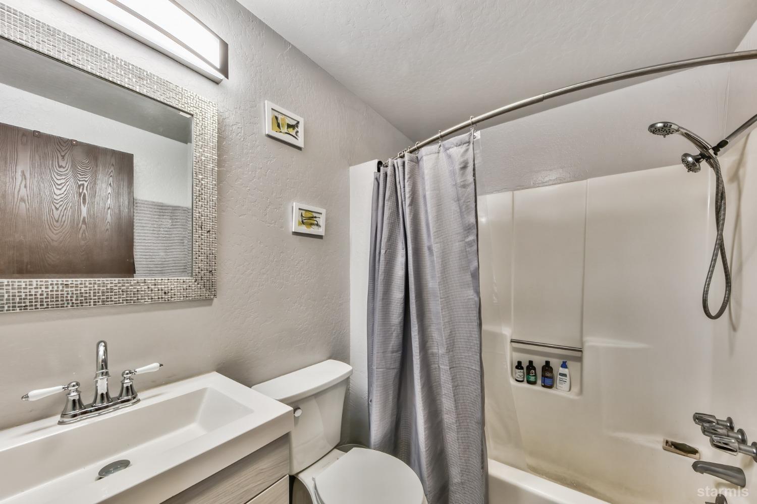 167 Tramway Drive, Unit B Stateline, NV 89449 - Photo 10 of 15 a bathroom with a sink toilet and shower