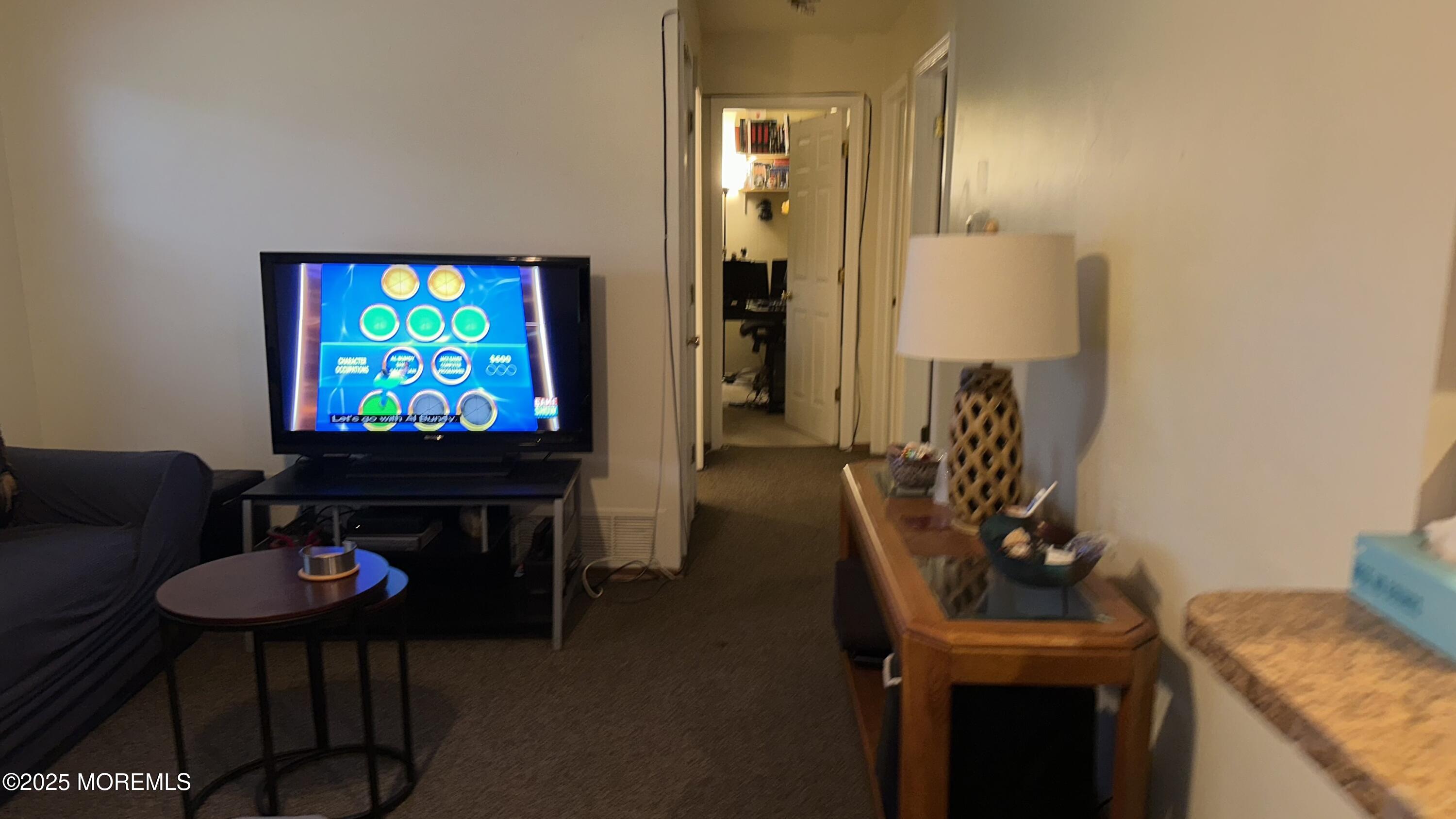 36 Liberty Street Freehold, NJ 07728 - Photo 11 of 20 a living room with furniture and a flat screen tv