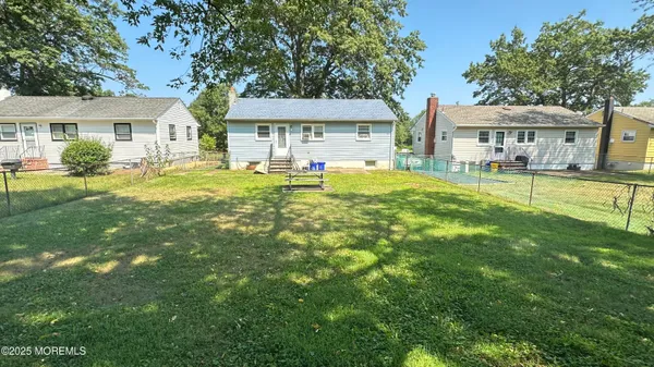 a front view of house with yard and seating area