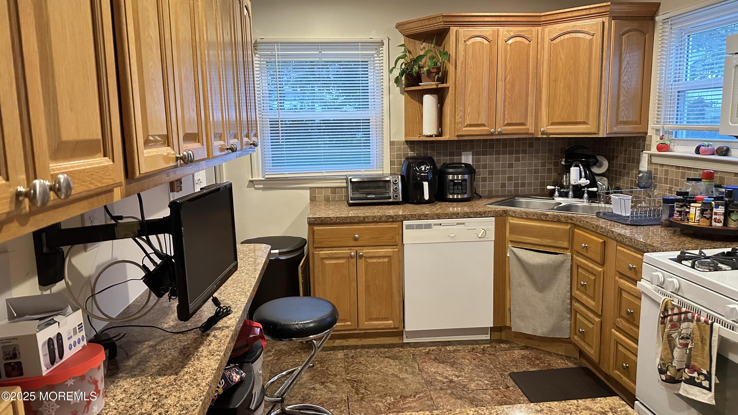 36 Liberty Street Freehold, NJ 07728 - Photo 20 of 20 a kitchen with appliances cabinets and a window