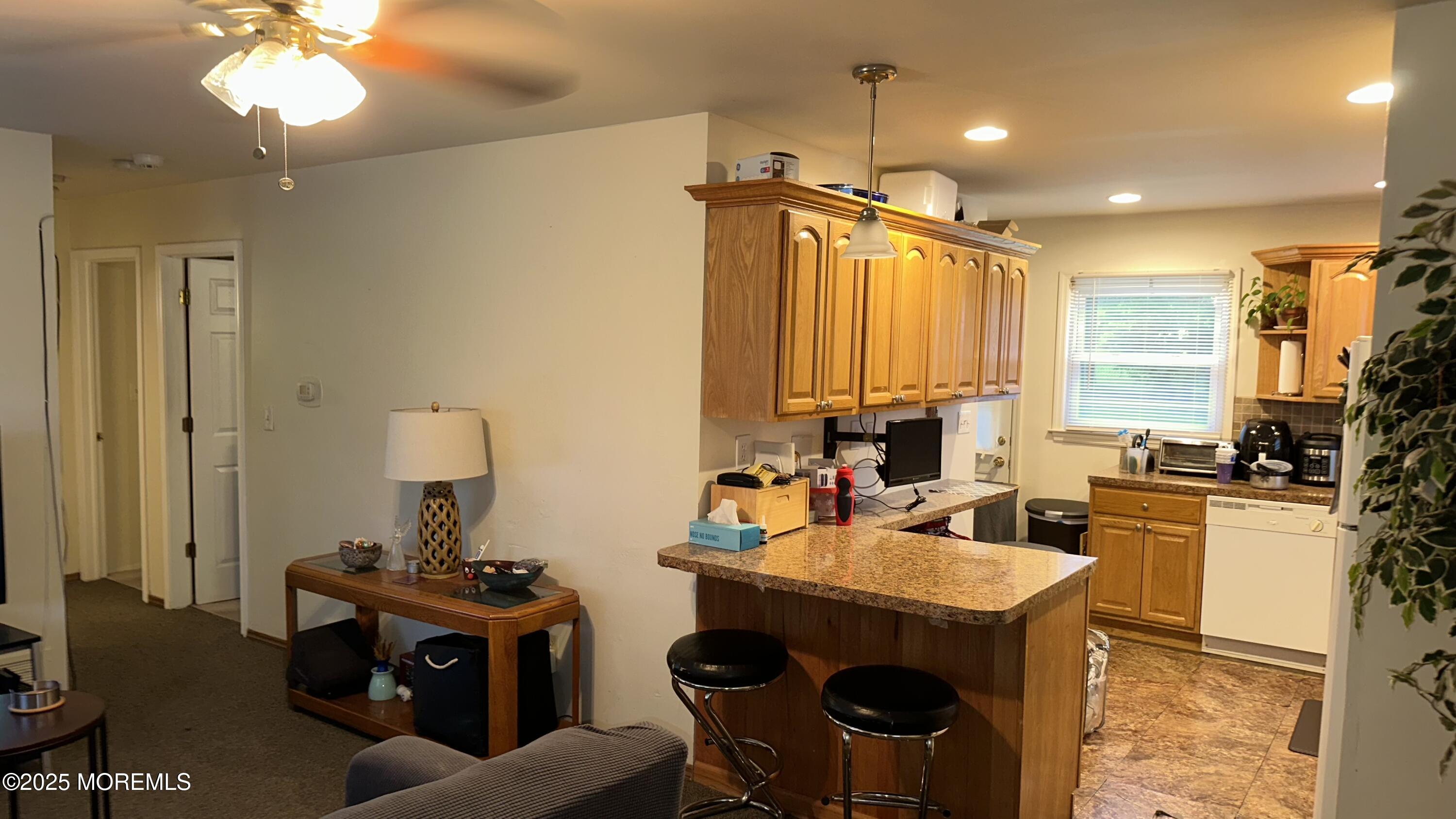 36 Liberty Street Freehold, NJ 07728 - Photo 4 of 20 a view of a dining room with furniture a chandelier and a large window