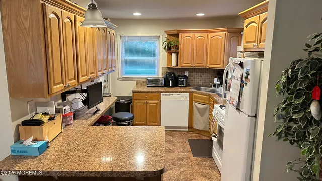 a view of a kitchen with appliances and cabinets