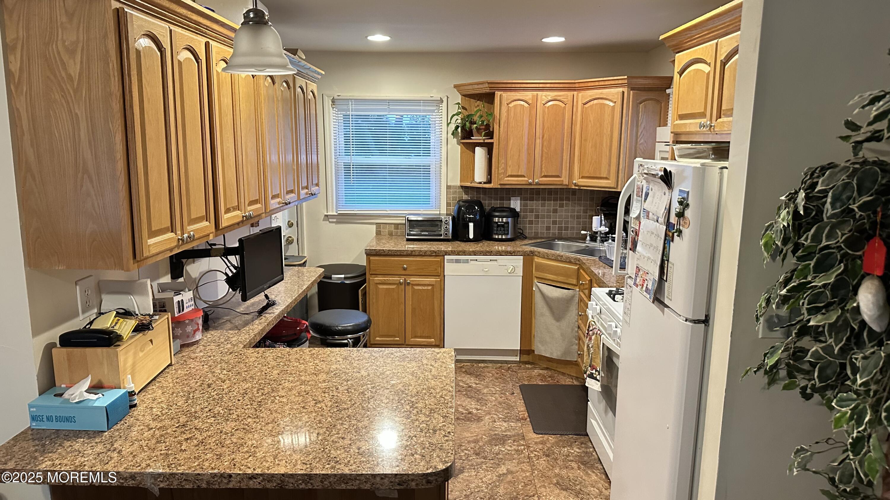36 Liberty Street Freehold, NJ 07728 - Photo 8 of 20 a view of a kitchen with appliances and cabinets