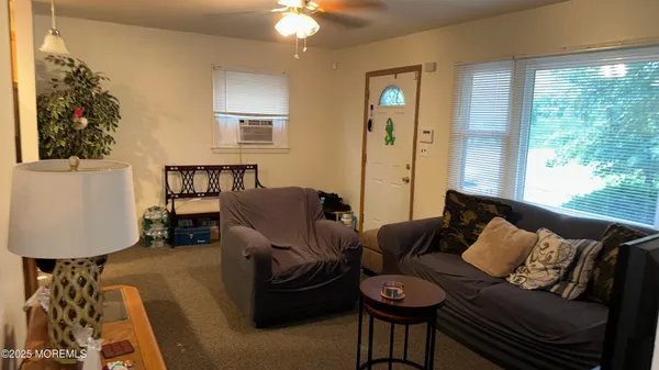 a living room with furniture and a window