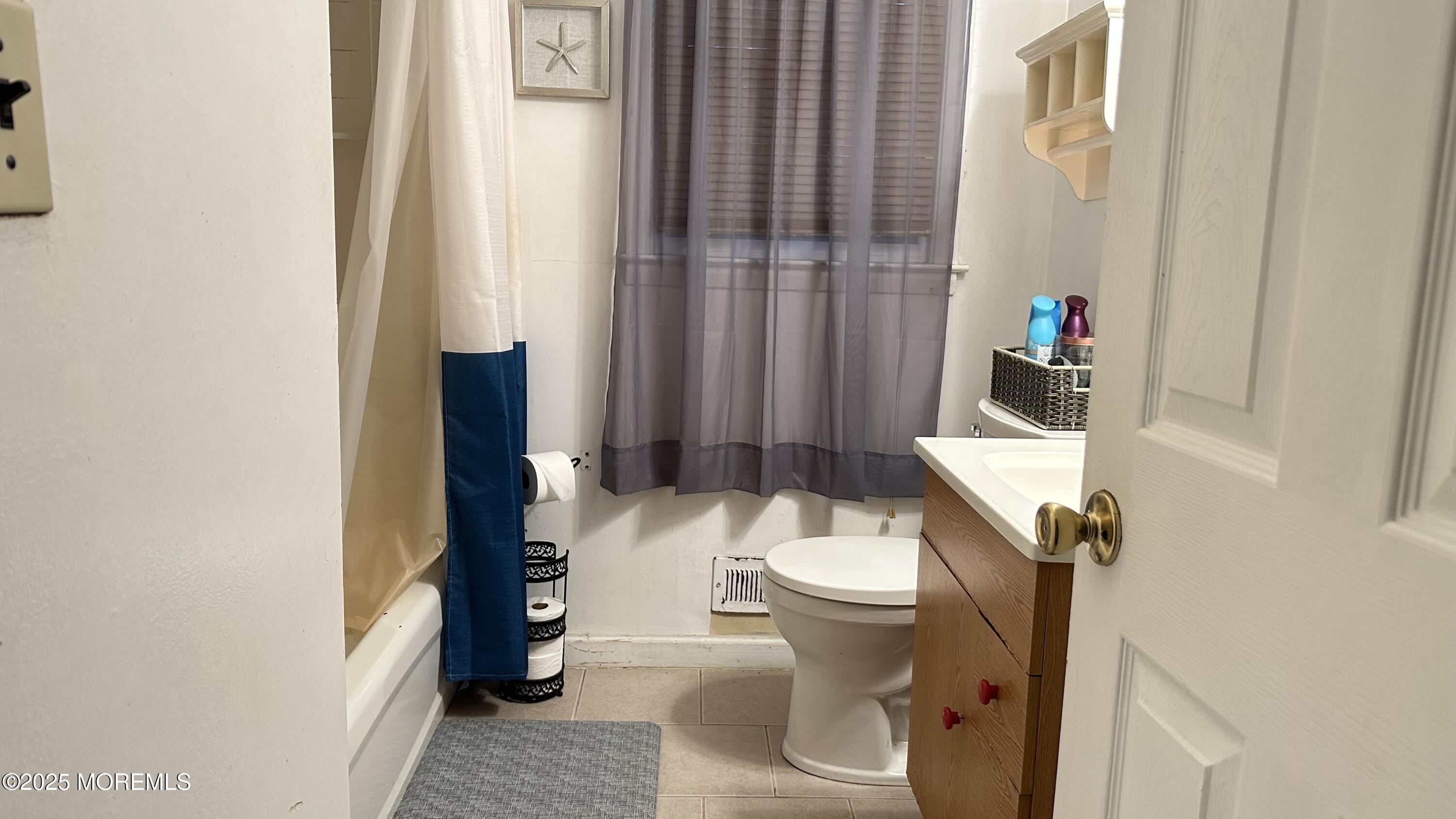 36 Liberty Street Freehold, NJ 07728 - Photo 10 of 20 a white toilet sitting next to a bathroom sink