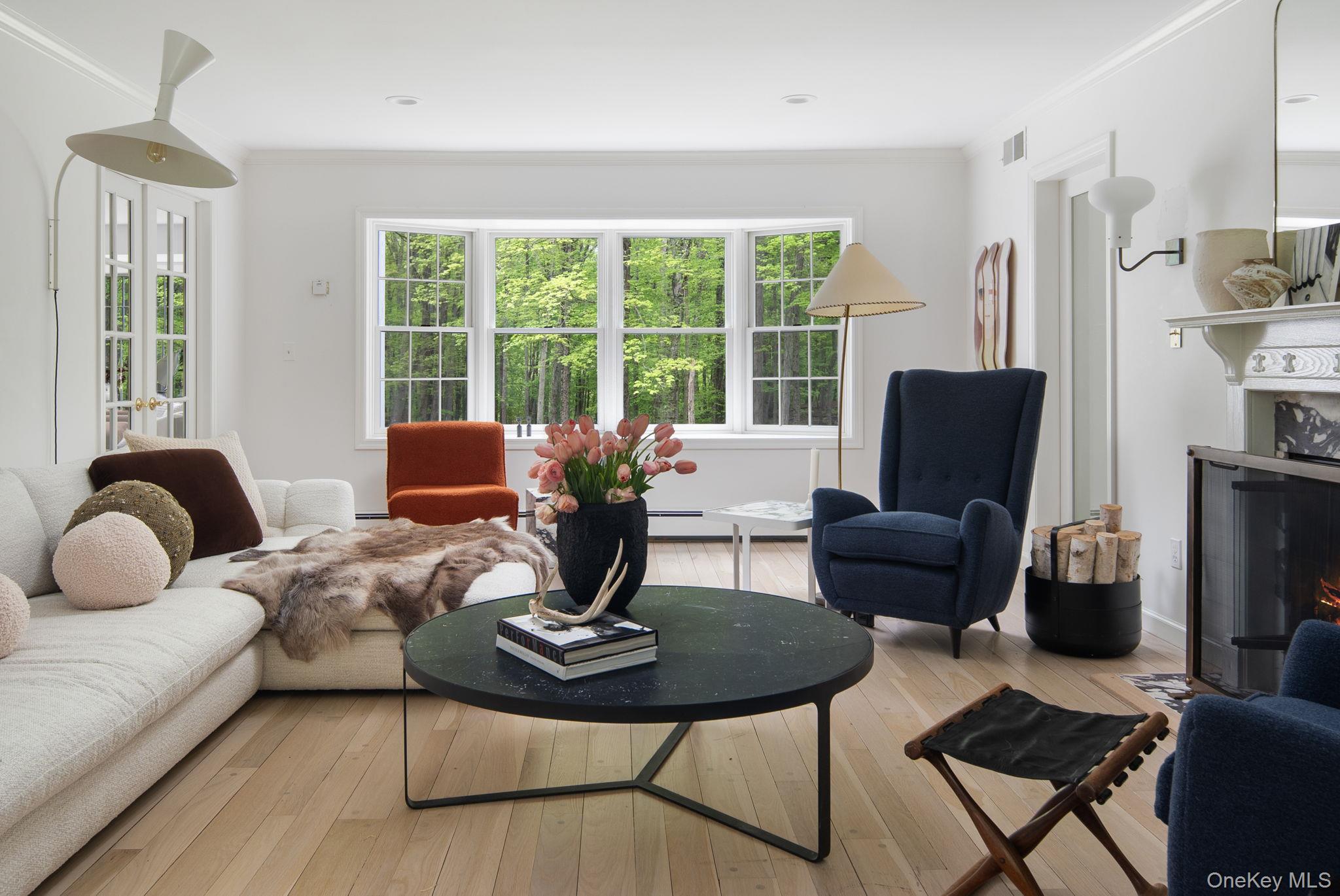 240 Eastwoods Road Pound Ridge, NY 10576 - Photo 6 of 13 a living room with furniture or couch and a window