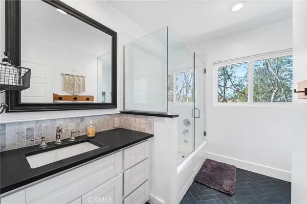 a bathroom with a sink and a mirror