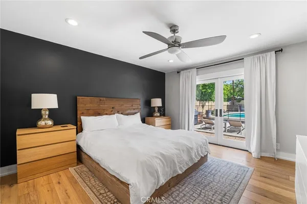 a bedroom with a large bed and a window