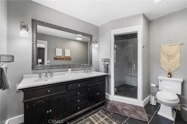 a spacious bathroom with a toilet sink and shower