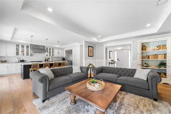 a living room with furniture kitchen and kitchen view