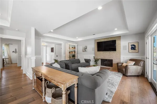 a living room with fireplace furniture and a flat screen tv