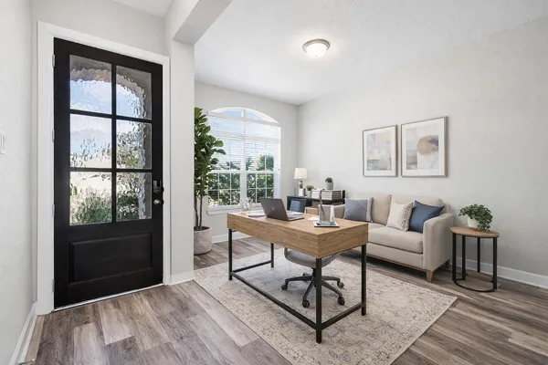 a living room with furniture and window