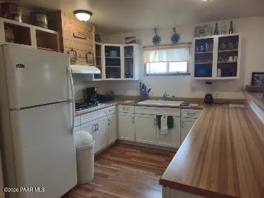 a kitchen with a stove and cabinets