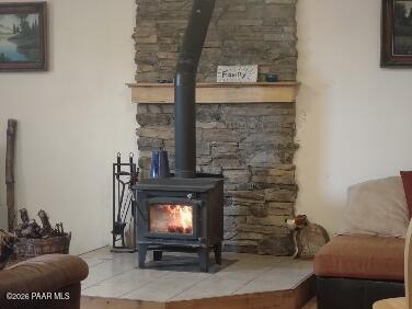 16432 Incline Trail Williams, AZ 86046 - Photo 20 of 62 a living room with furniture a flat screen tv and a fireplace
