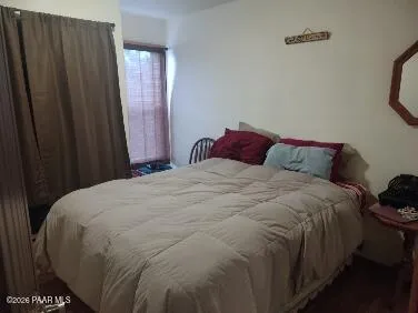 a white toilet sitting next to a bath tub and shower