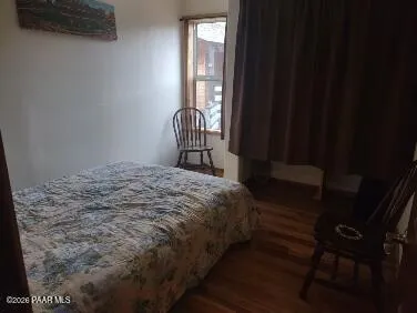 a view of a balcony with wooden floor and outdoor space