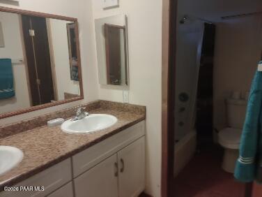 16432 Incline Trail Williams, AZ 86046 - Photo 25 of 62 a bathroom with a granite countertop sink and a mirror