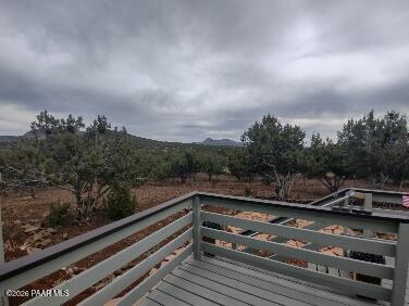 16432 Incline Trail Williams, AZ 86046 - Photo 31 of 62 a view of a balcony with wooden floor and outdoor space