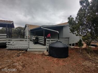 16432 Incline Trail Williams, AZ 86046 - Photo 39 of 62 a living room with furniture and a flat screen tv