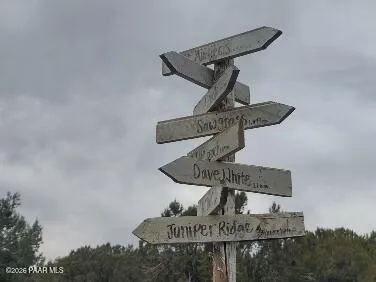 a living room with a table tennis table and floor to ceiling window