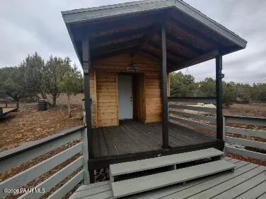a view of mountains in middle of the forest