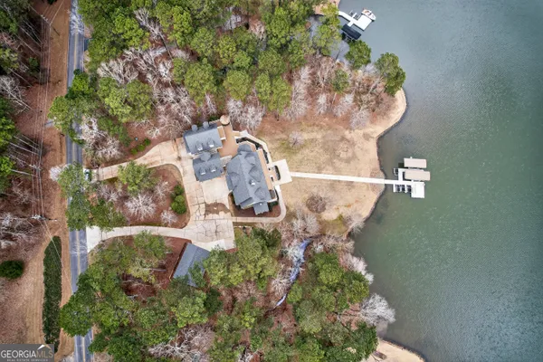 an aerial view of a houses with a city street