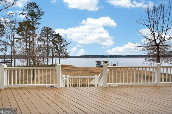 a bedroom with furniture and wooden floor