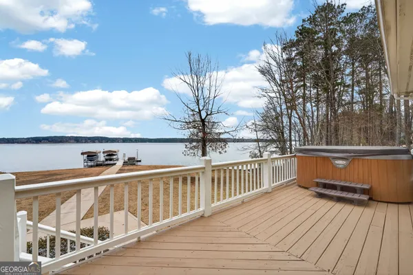 a bathroom with a double vanity sink toilet and a mirror