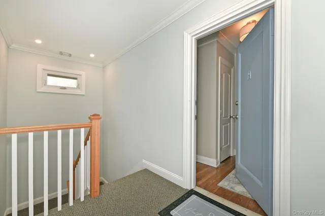 a view of a hallway with entryway