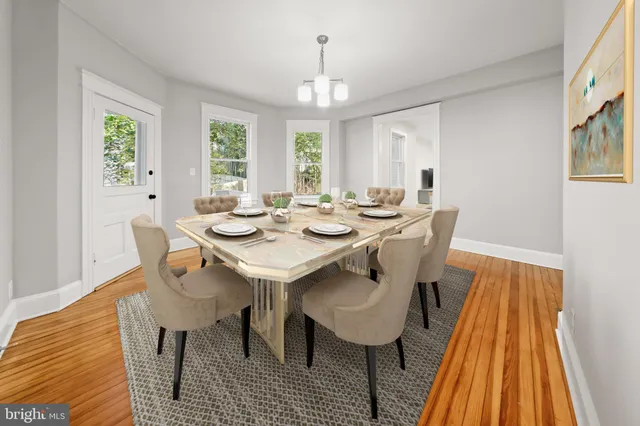 a view of a dining room with furniture and window