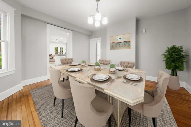 a view of a kitchen with wooden floor and a window
