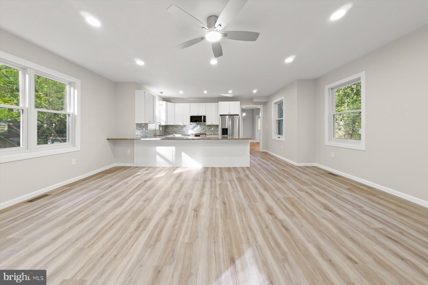 10220 Capitol View Avenue Silver Spring, MD 20910 - Photo 19 of 66 a view of a kitchen with wooden floor and a window