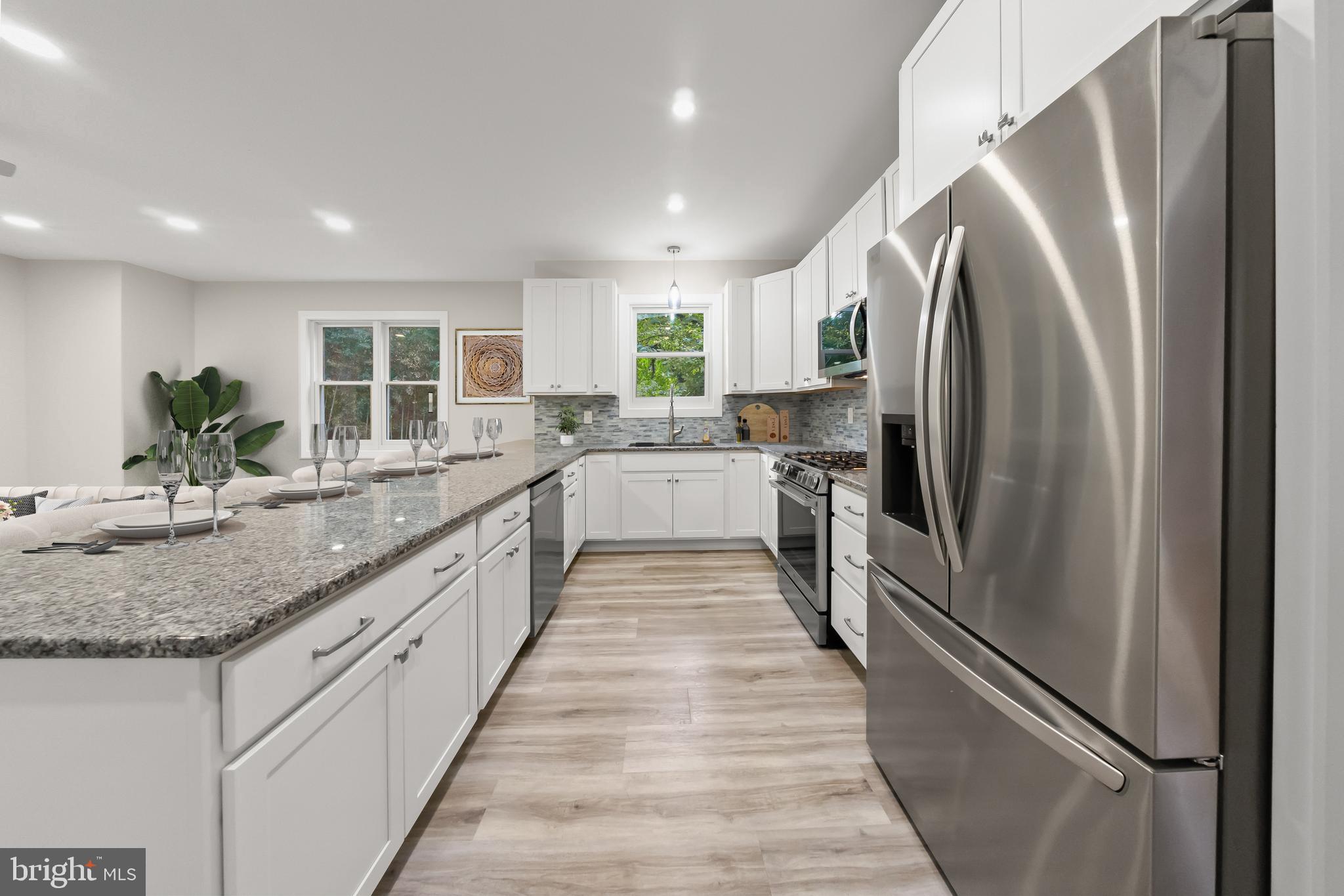 10220 Capitol View Avenue Silver Spring, MD 20910 - Photo 32 of 66 a large kitchen with stainless steel appliances granite countertop a refrigerator and a sink