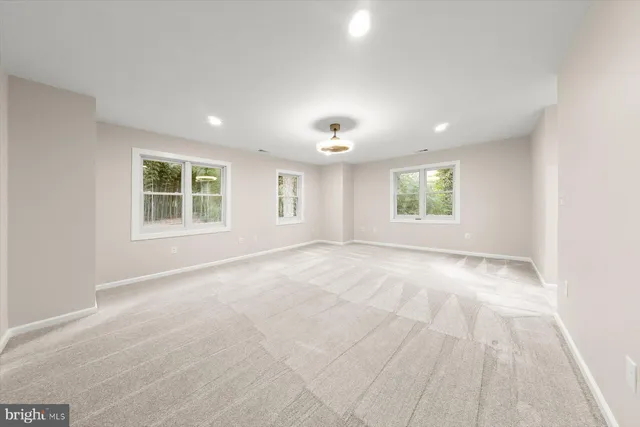 a bathroom with a double vanity sink mirror and toilet